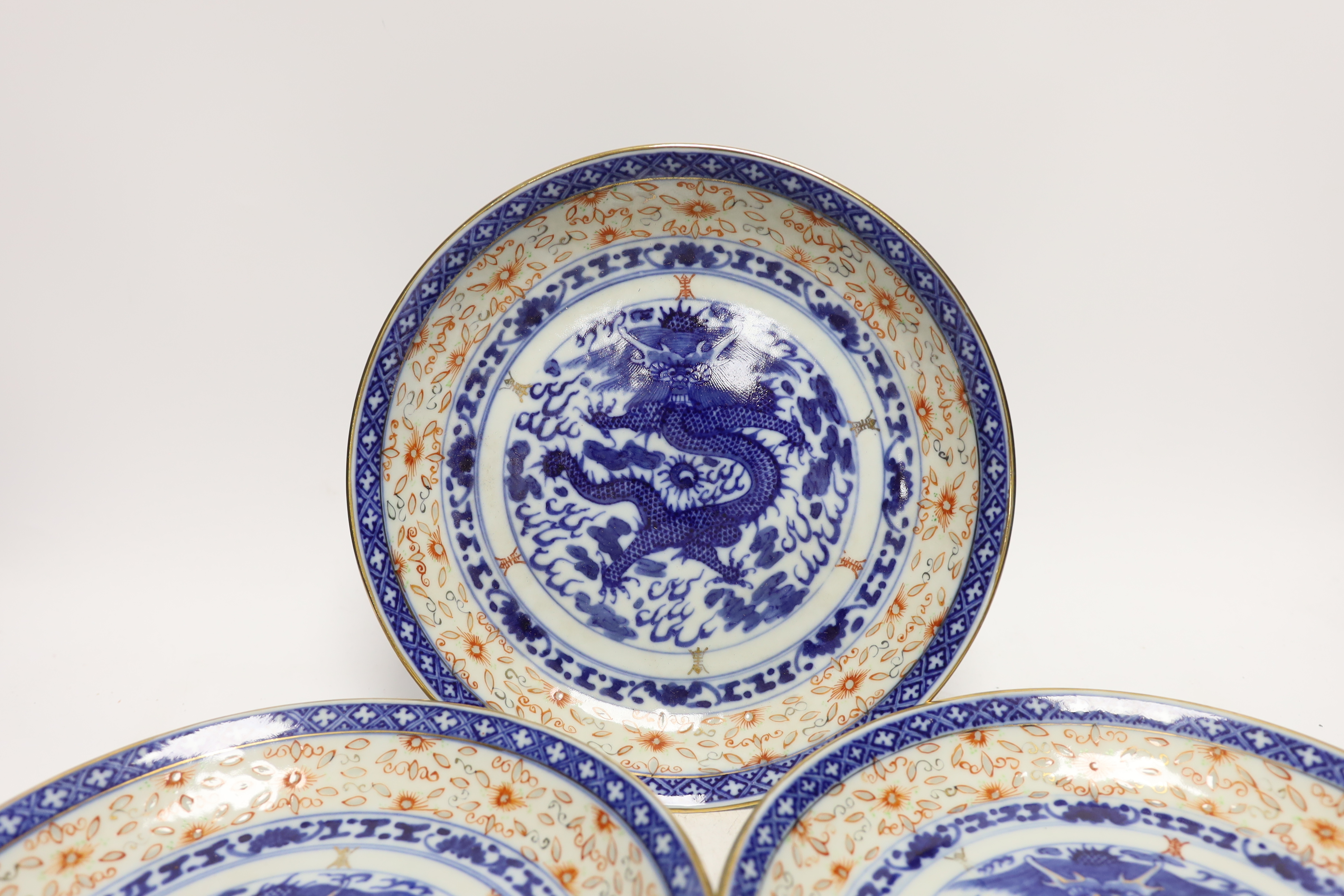Three Chinese blue and white ‘dragon’ dishes, 24cm diameter